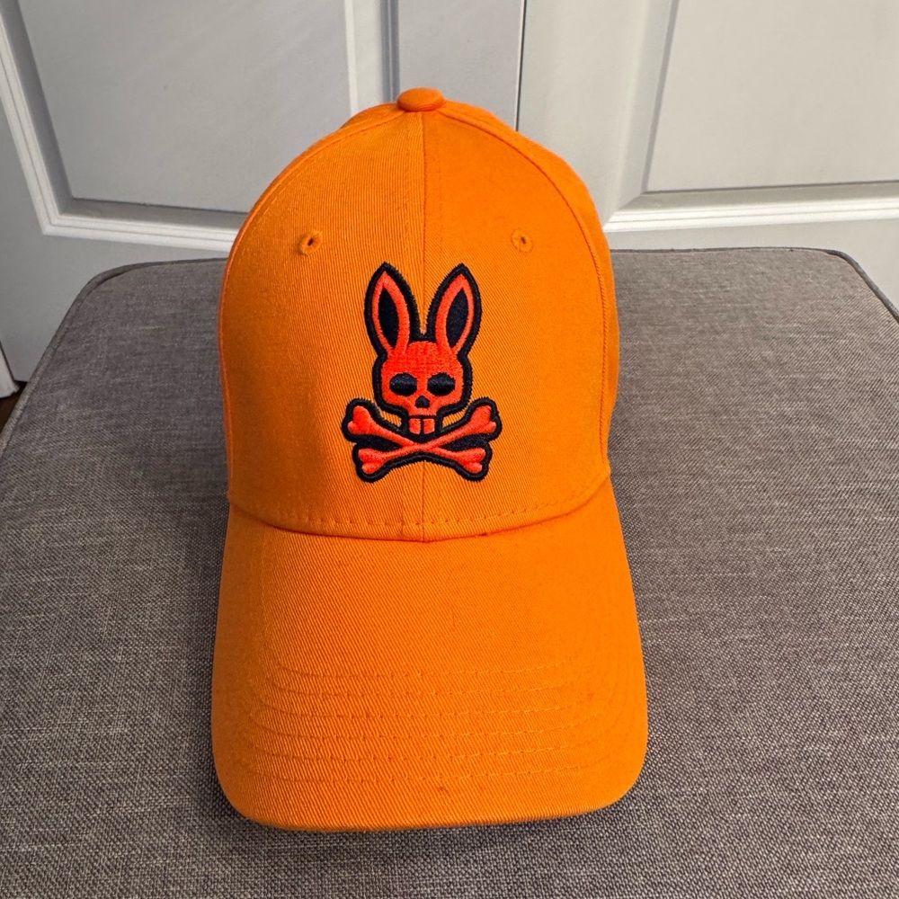 Orange Cap with Skull and Crossbones Logo